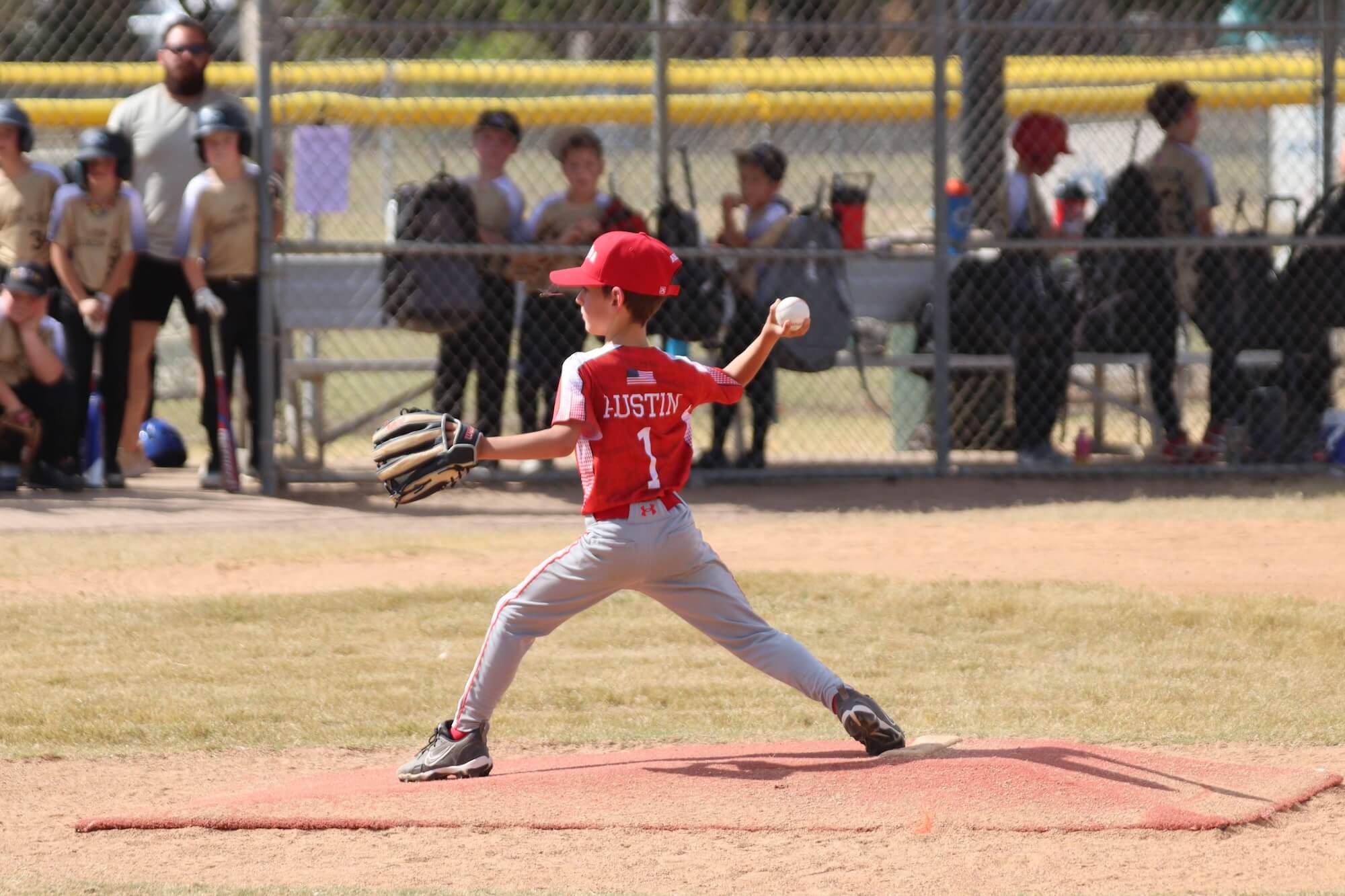 A child smiling with a dolphin