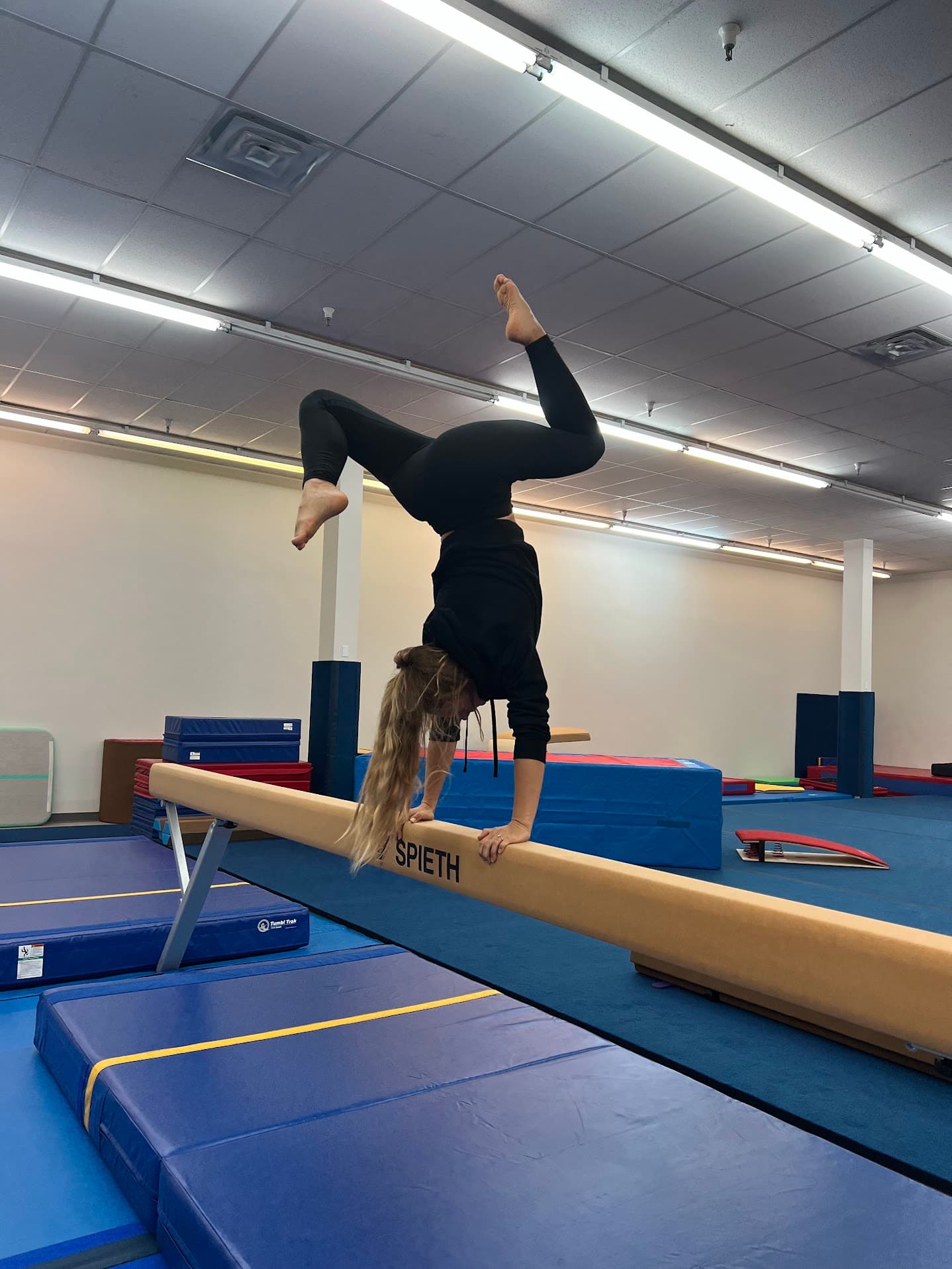 Adult gymnast training on the floor
