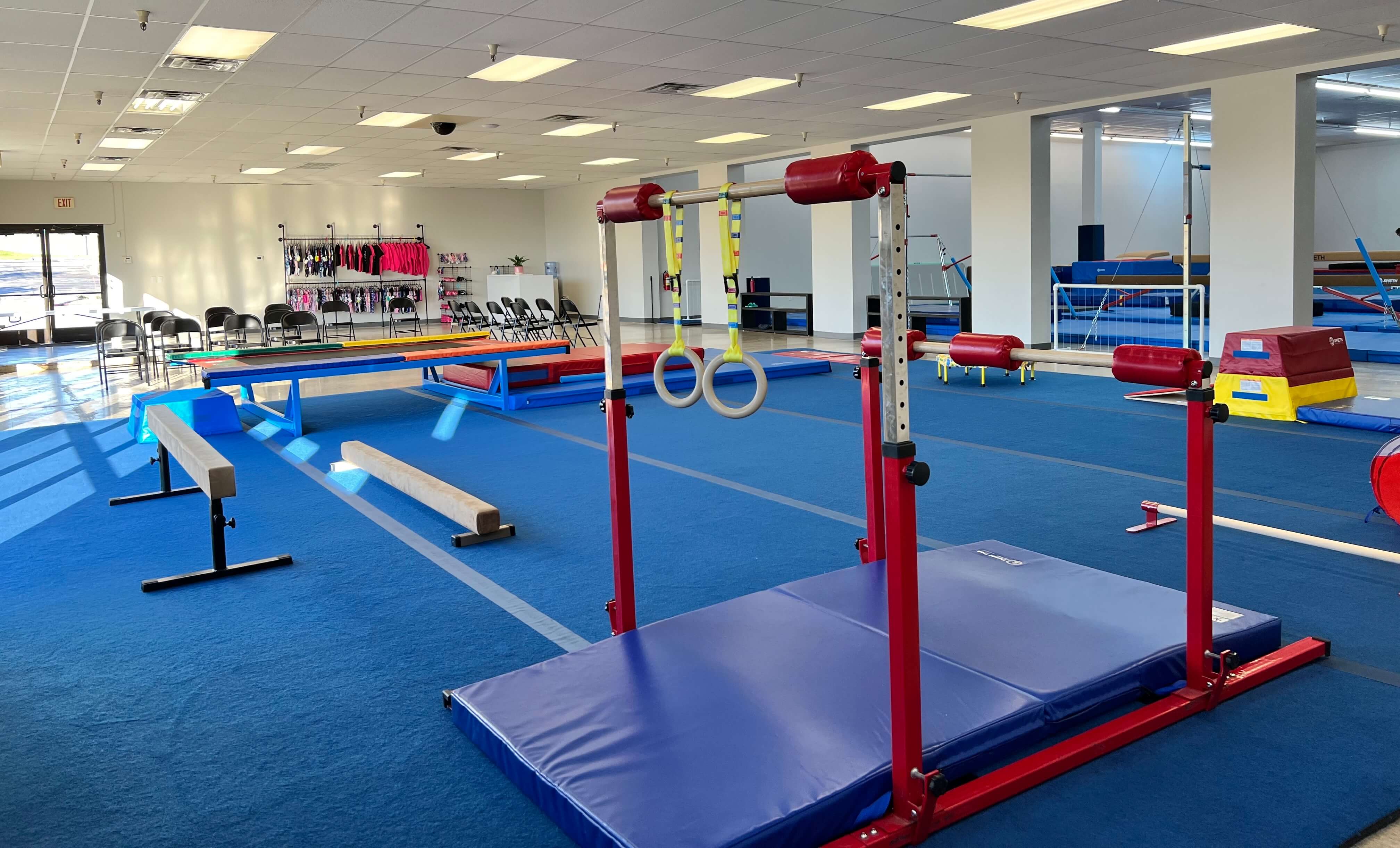 Preschool gymnast exploring age-appropriate equipment