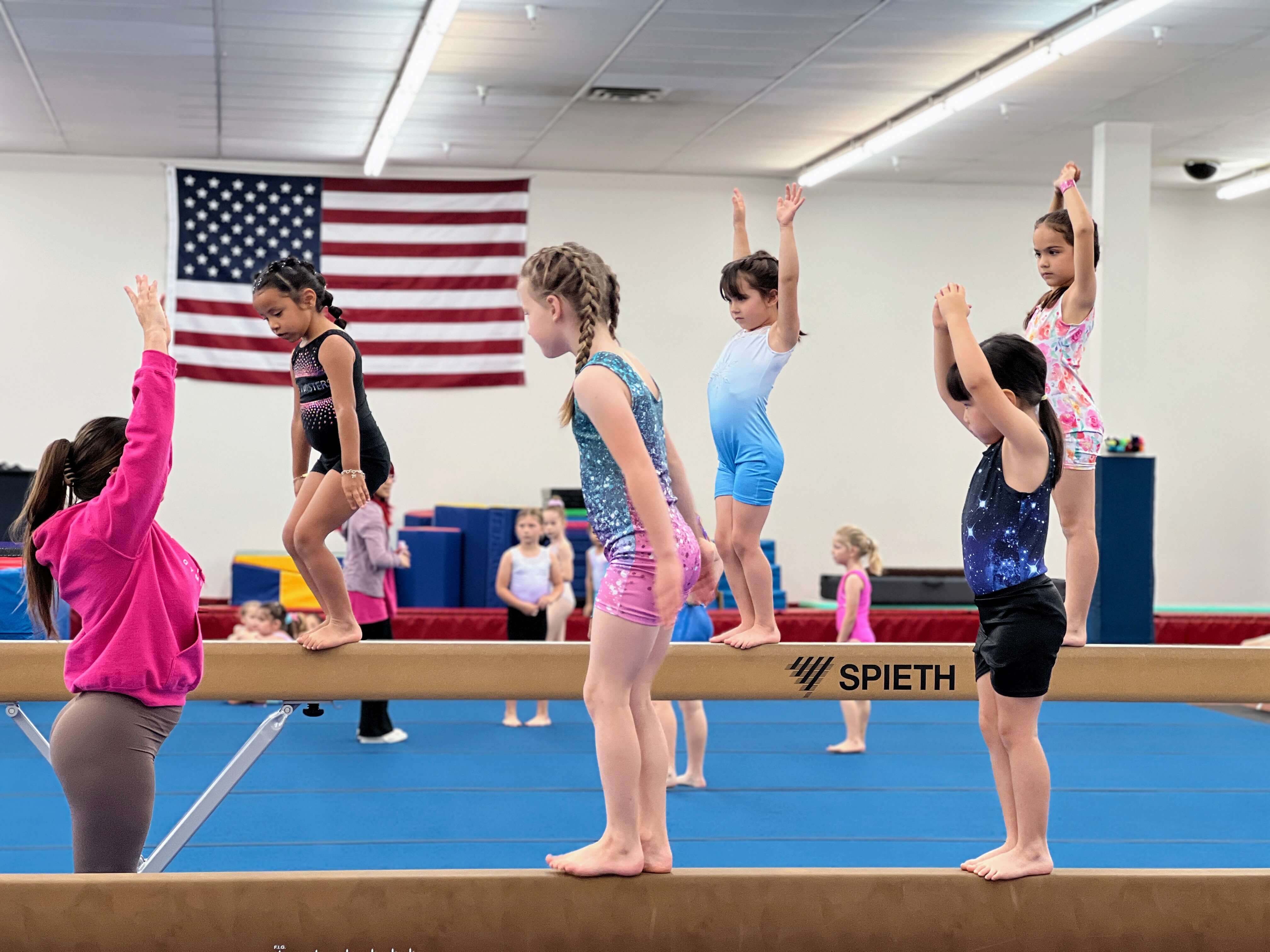 Athletes training floor skills in recreational class
